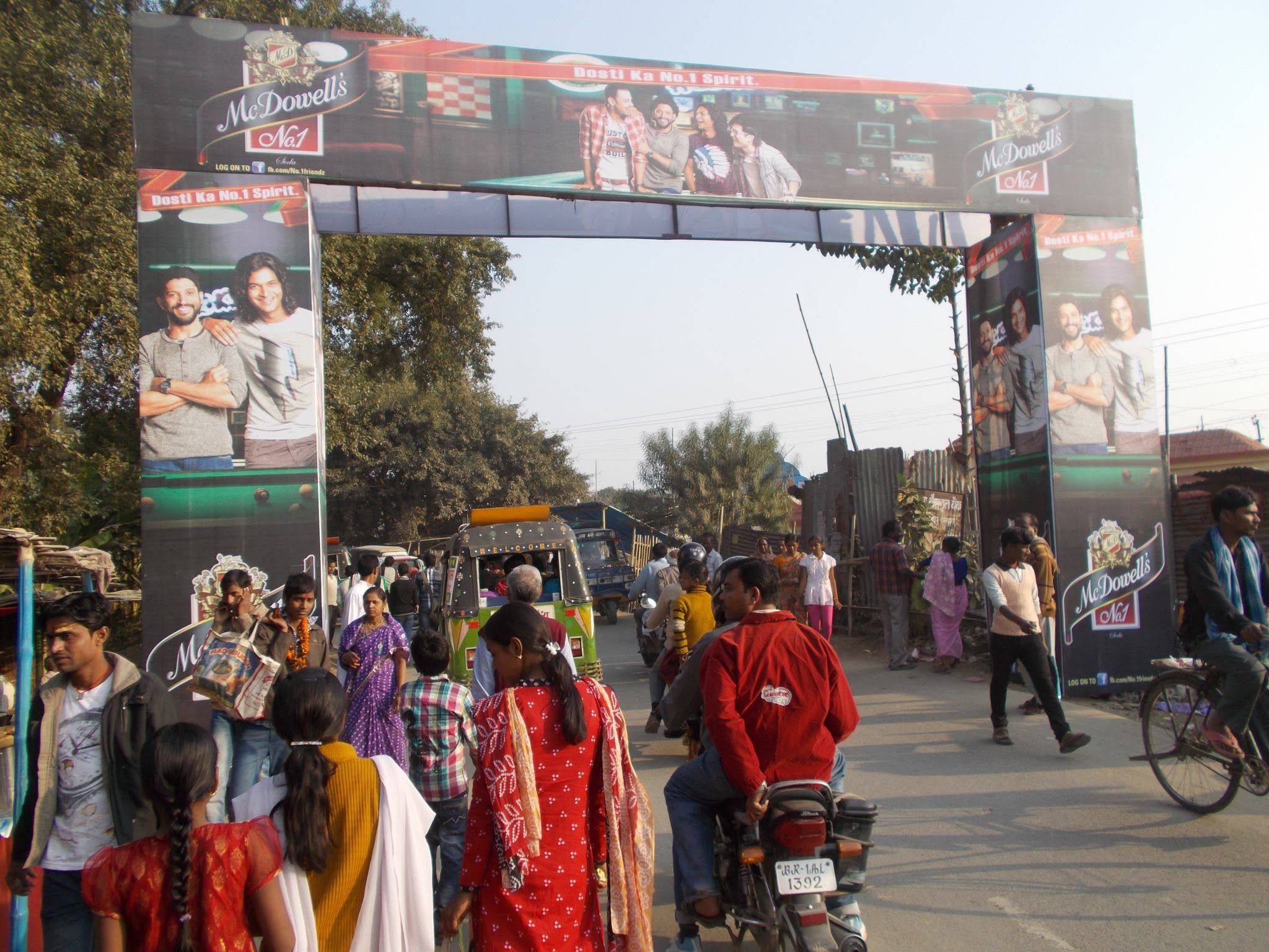 McDowell's outdoor arch spanning a busy road in Bihar